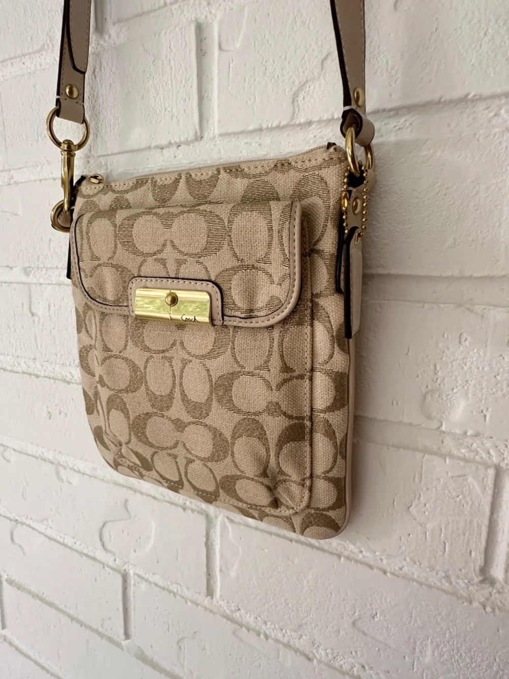 Coach Kristin Signature Crossbody Swing Bag in a metallic gold and beige fabric